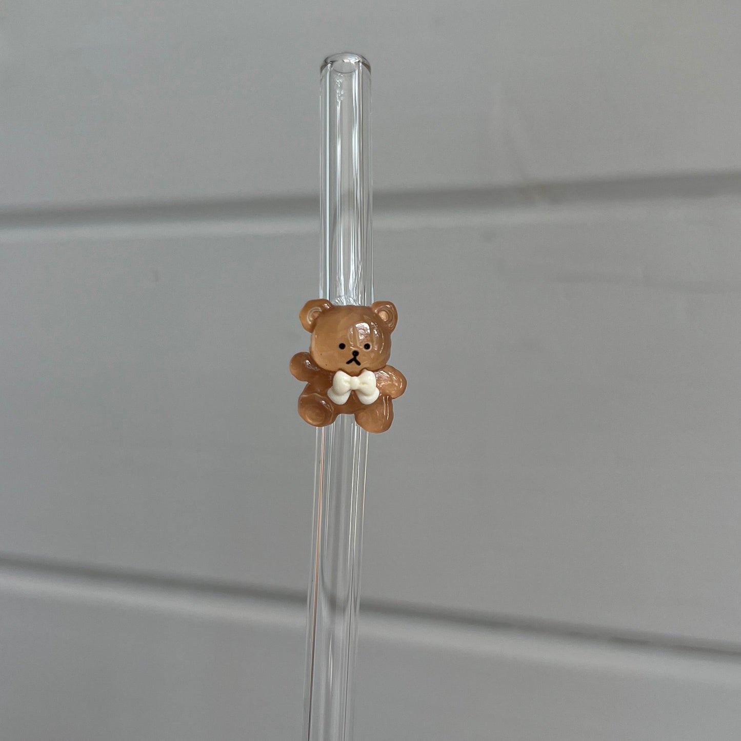 Glassugrör med figur