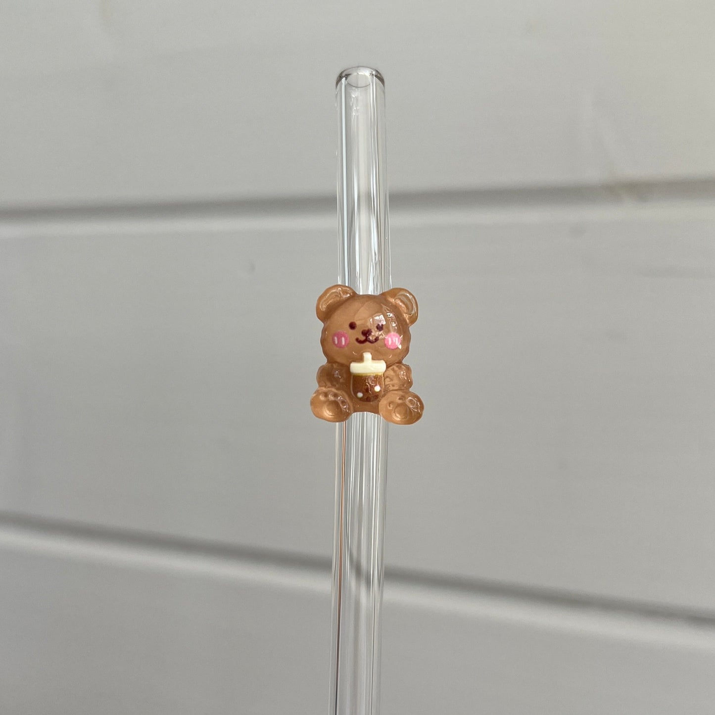 Glassugrör med figur
