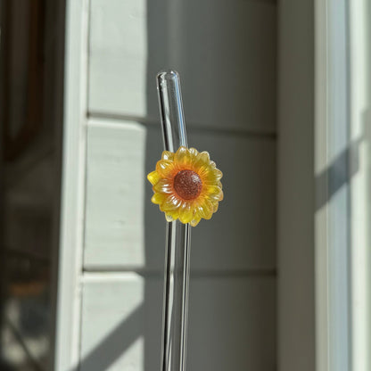 Glassugrör med blomma