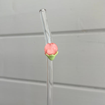 Glassugrör med blomma